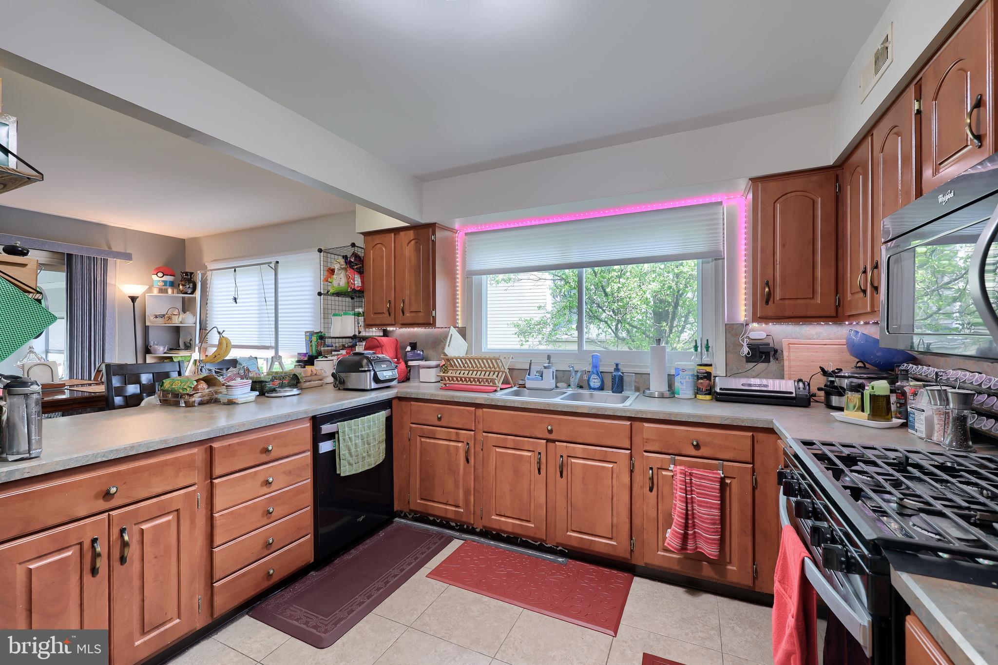 2188 Esbenshade Road York, PA 17408 - Photo 6 of 29 a kitchen with a sink stove and cabinets