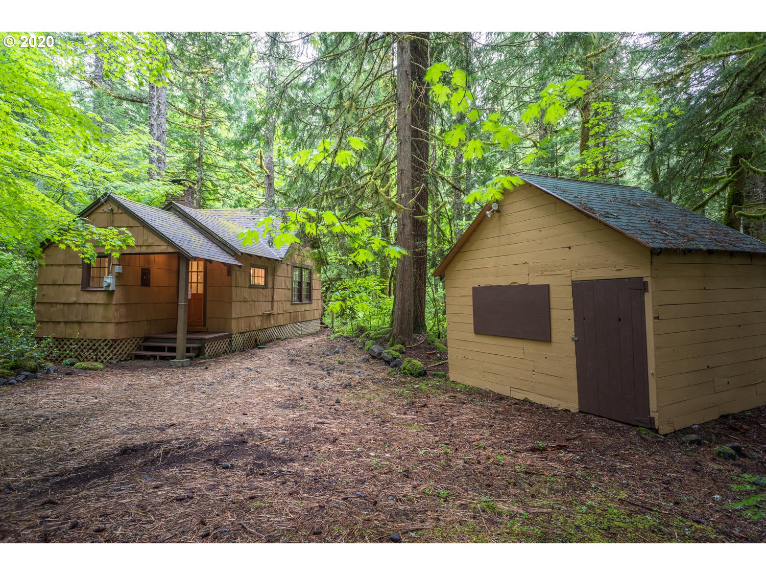 79686 Road 35 A, Unit LOT60 Rhododendron, OR 97049 - Photo 2 of 25 a view of a house with a yard