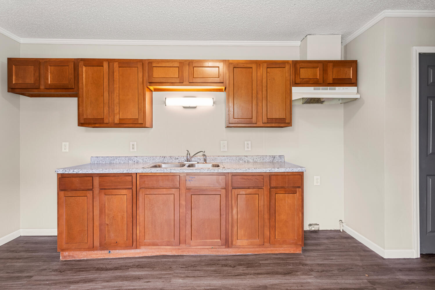 3214 York Drive Champaign, IL 61821 - Photo 11 of 27 a bathroom with a sink a mirror and a wooden floor