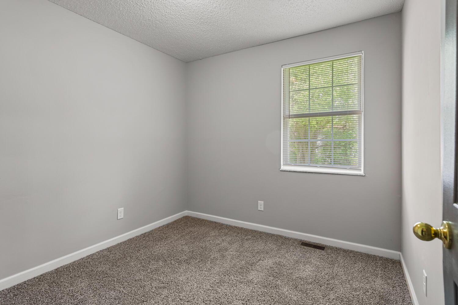3214 York Drive Champaign, IL 61821 - Photo 17 of 27 an empty room with a window