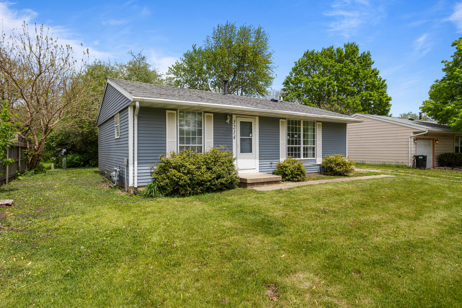 3214 York Drive Champaign, IL 61821 - Photo 2 of 27 a view of a house with backyard and garden