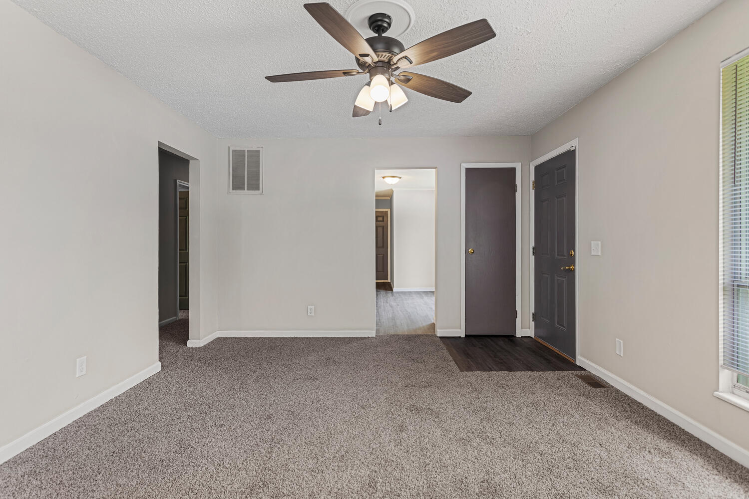 3214 York Drive Champaign, IL 61821 - Photo 8 of 27 an empty room with closet and a ceiling fan