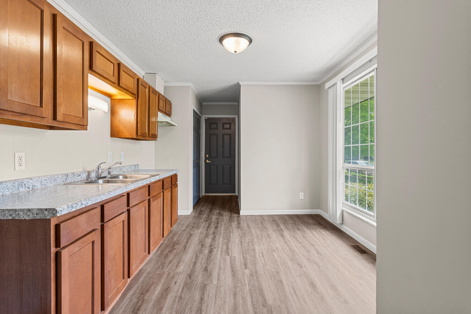 3214 York Drive Champaign, IL 61821 - Photo 9 of 27 a bathroom with a granite countertop sink and a large mirror