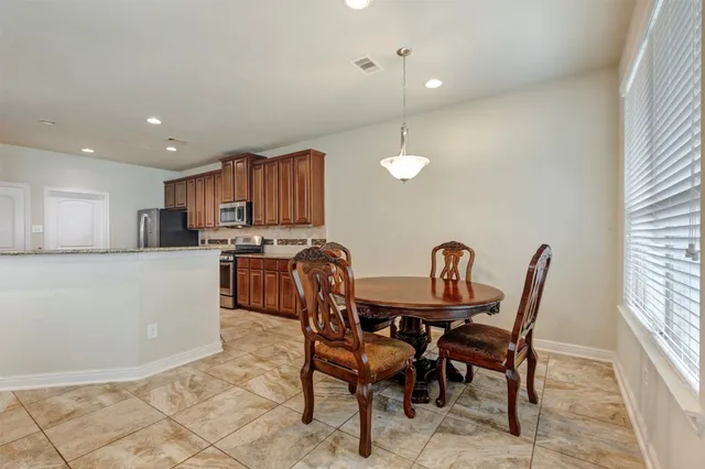 a view of a dining room with furniture
