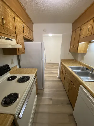 a kitchen with a stove and a refrigerator