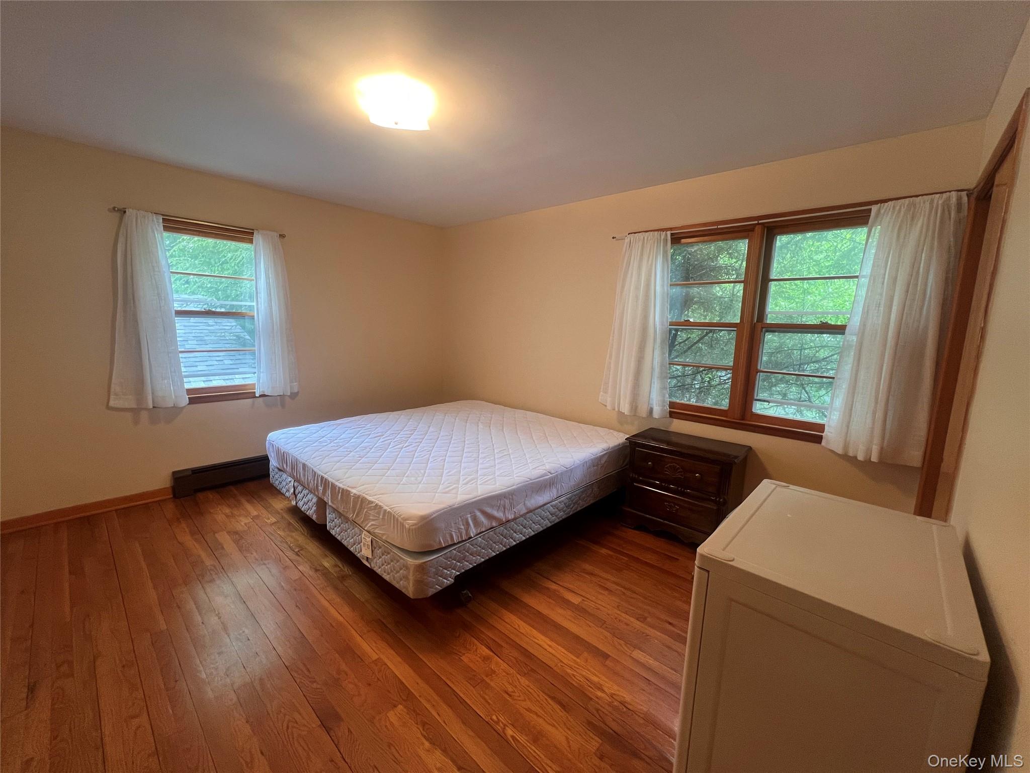 4 Beach Road, Unit G Glen Spey, NY 12737 - Photo 11 of 16 a bedroom with a bed and window