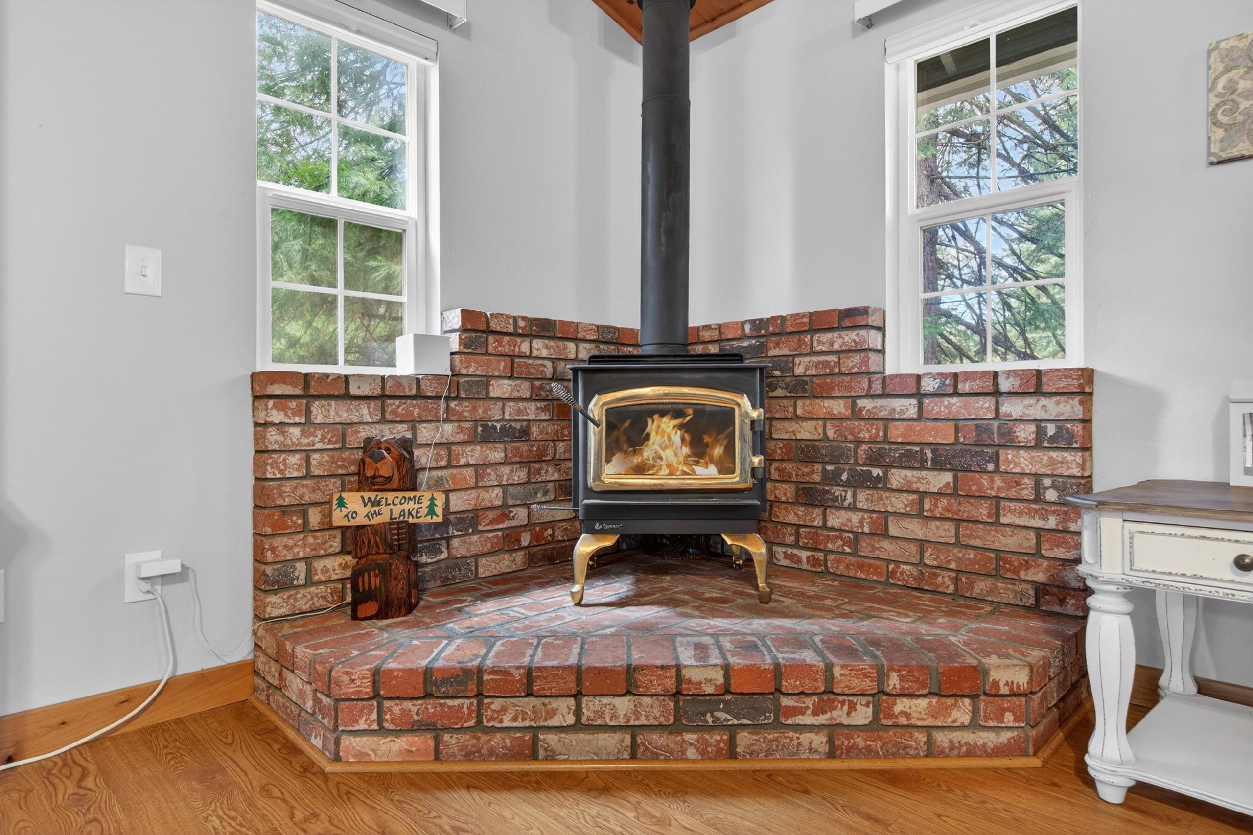 1220 Lynx Road Lake Almanor, CA 96137 - Photo 9 of 45 a living room with fireplace furniture and a window