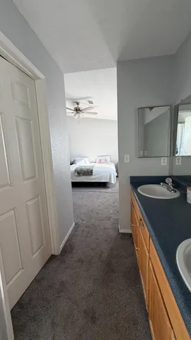 a kitchen with sink and cabinets