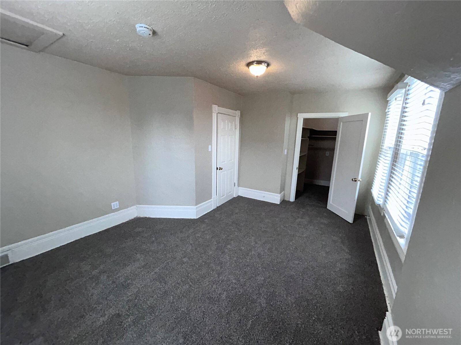 2716 South 14th Street Tacoma, WA 98405 - Photo 15 of 28 an empty room with windows and entrance