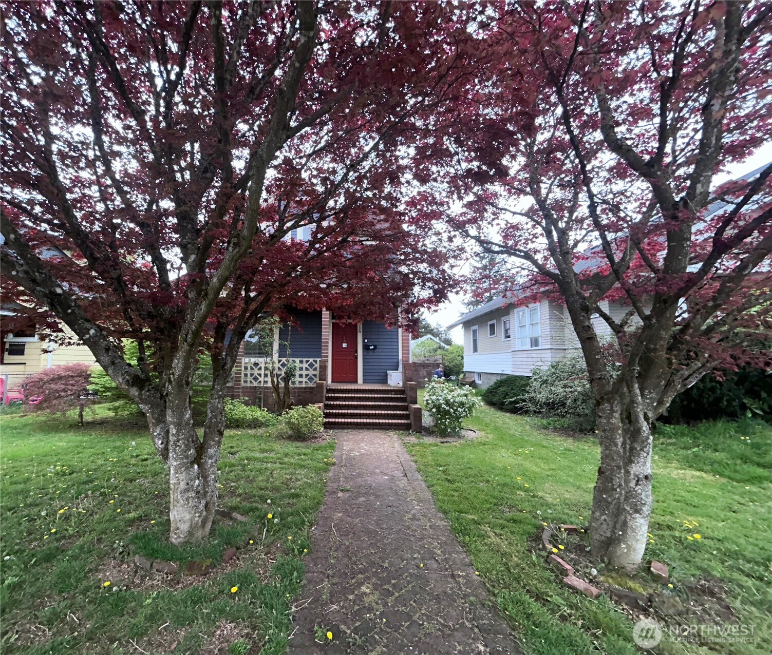 2716 South 14th Street Tacoma, WA 98405 - Photo 2 of 28 a front view of a house with yard and green space