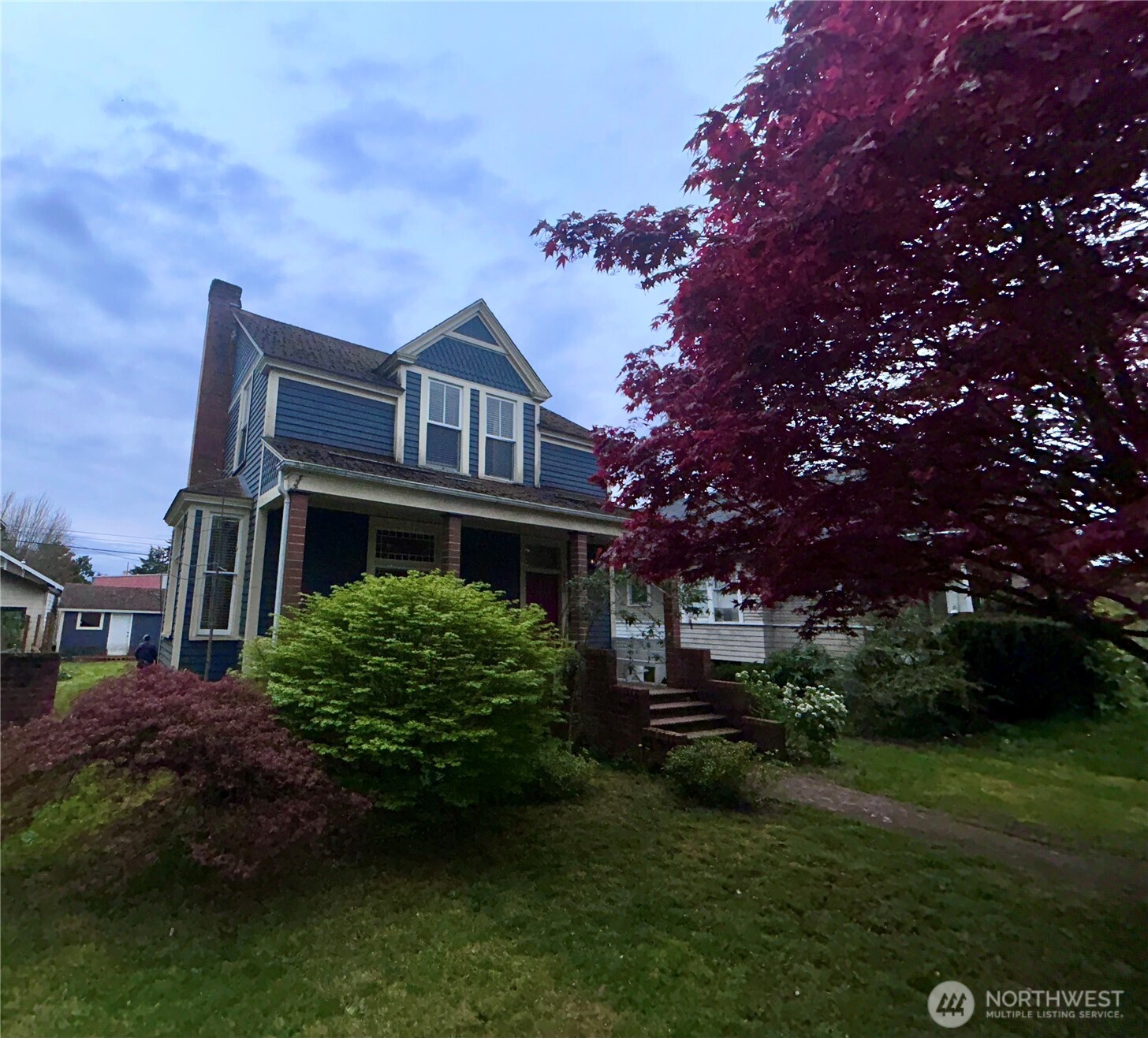 2716 South 14th Street Tacoma, WA 98405 - Photo 26 of 28 a front view of a house with a garden