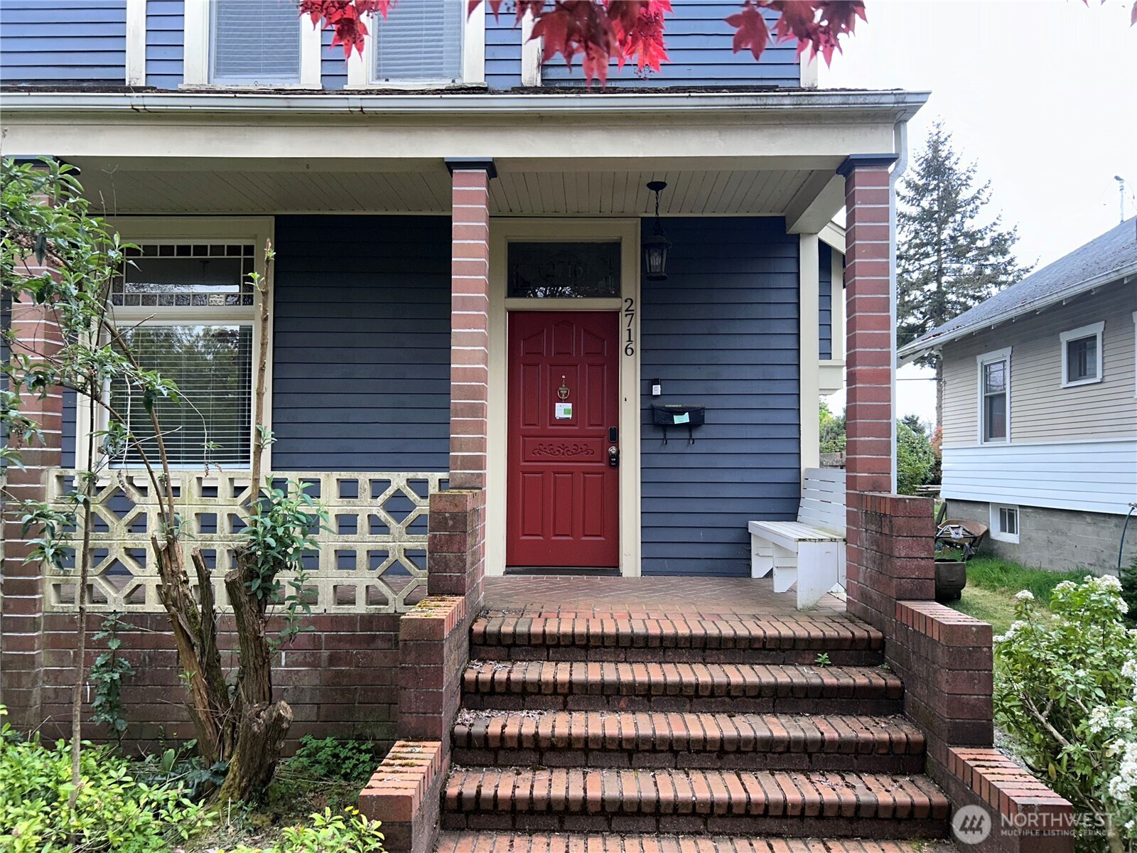 2716 South 14th Street Tacoma, WA 98405 - Photo 3 of 28 a front view of a house with a garden