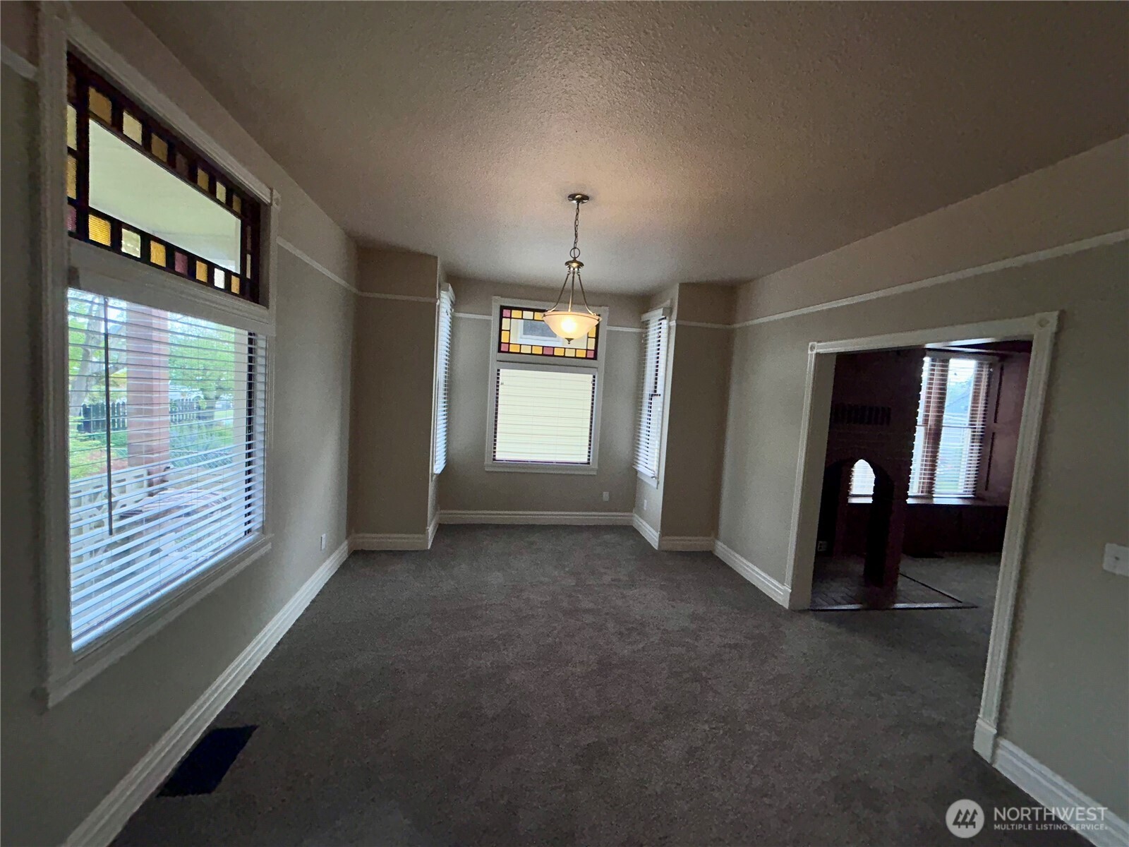 2716 South 14th Street Tacoma, WA 98405 - Photo 9 of 28 a view of an empty room with window and stairs