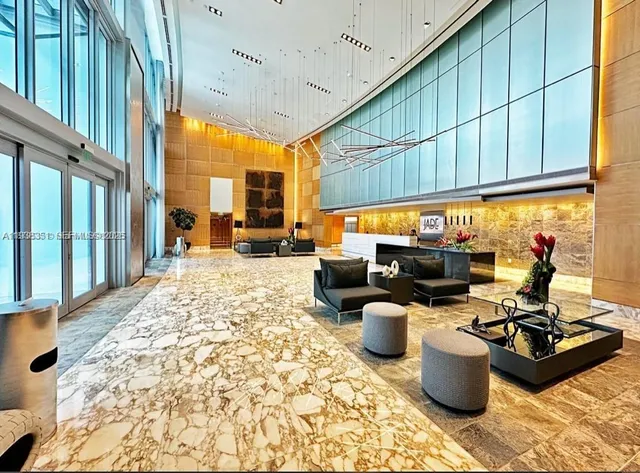 a view of a lake with tall buildings