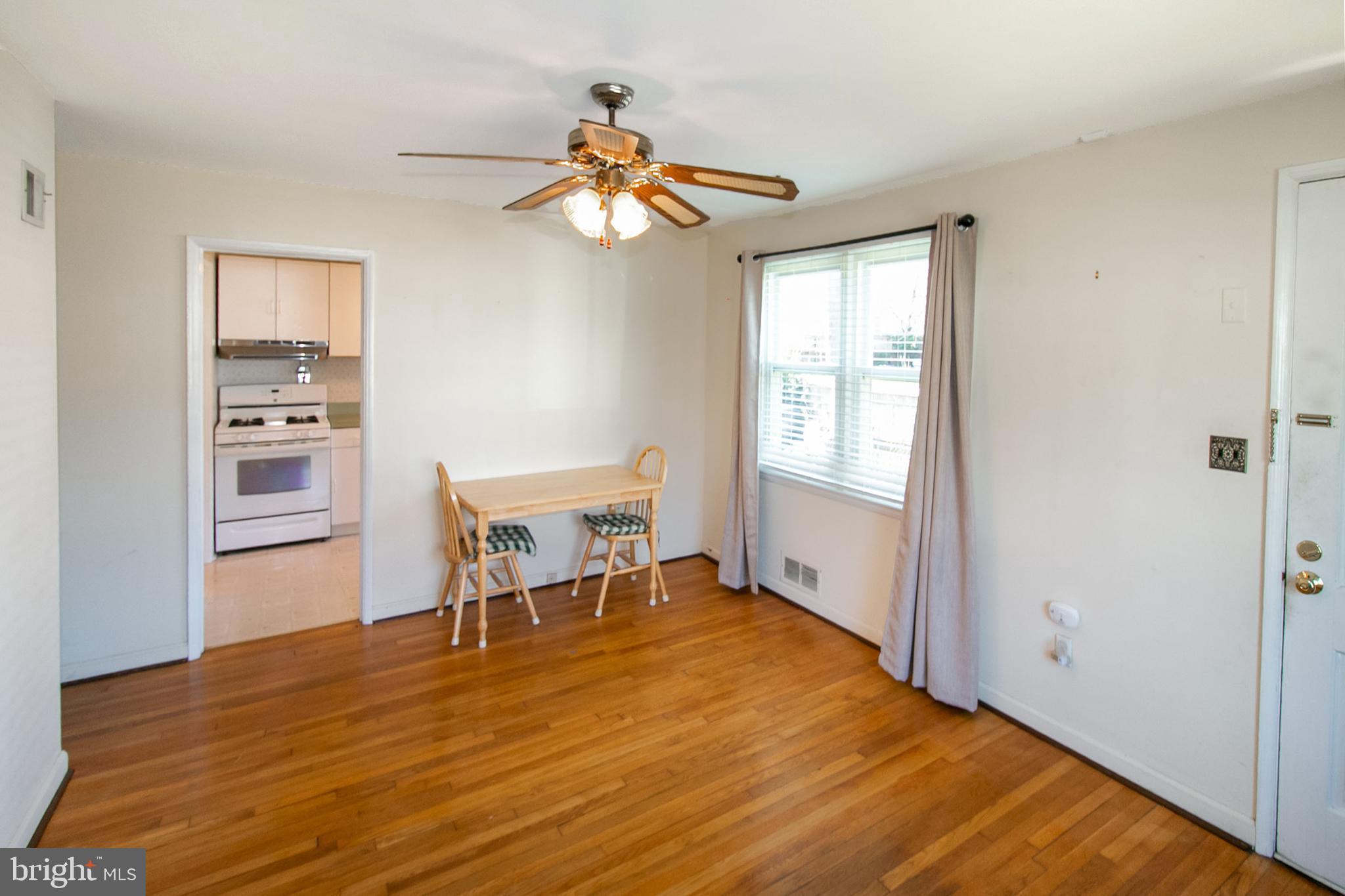 6939 Weston Road Falls Church, VA 22042 - Photo 11 of 25 a bedroom with a bed and a chandelier