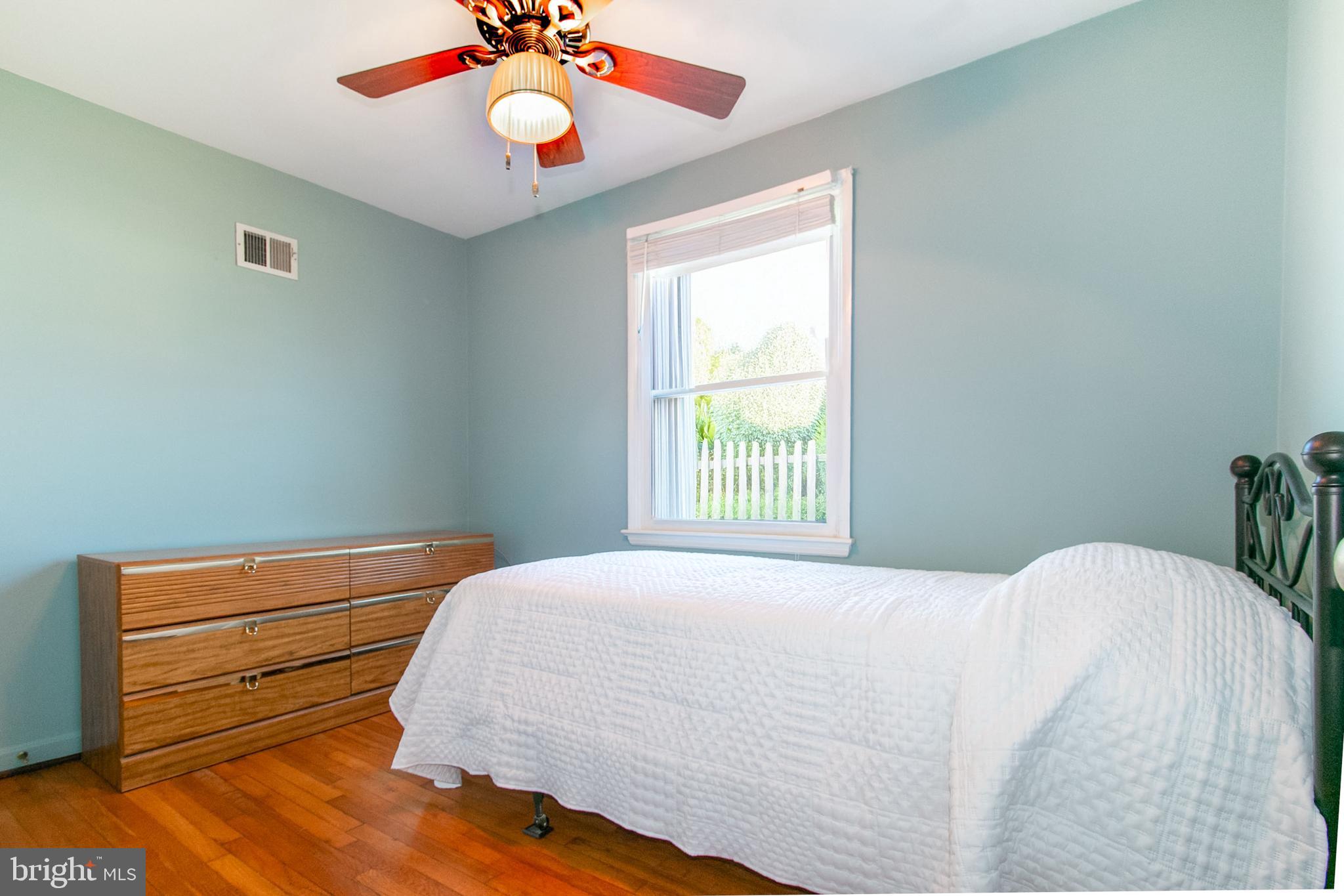 6939 Weston Road Falls Church, VA 22042 - Photo 18 of 25 a bedroom with a bed and a window