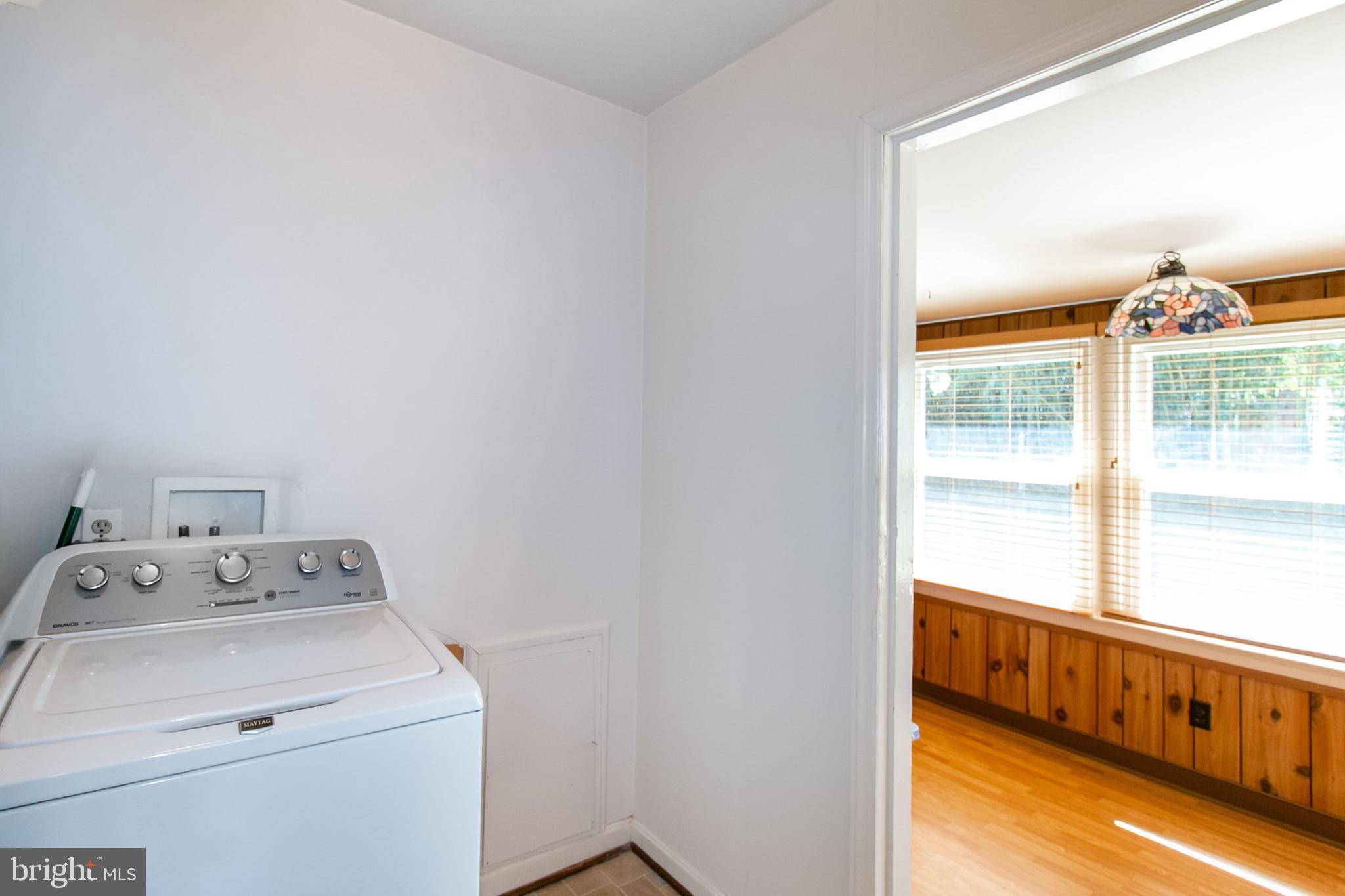 6939 Weston Road Falls Church, VA 22042 - Photo 22 of 25 a utility room with dryer and washer