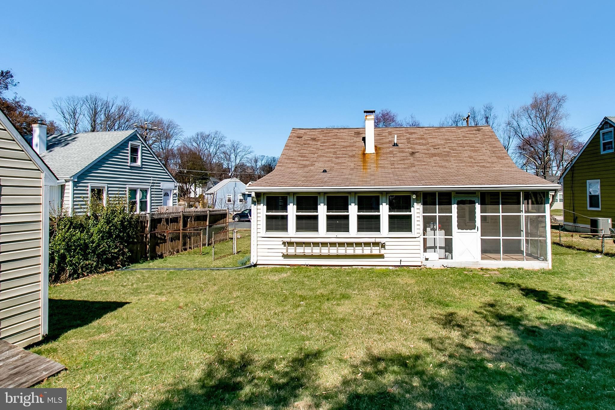 6939 Weston Road Falls Church, VA 22042 - Photo 5 of 25 a front view of a house with a yard table and chairs