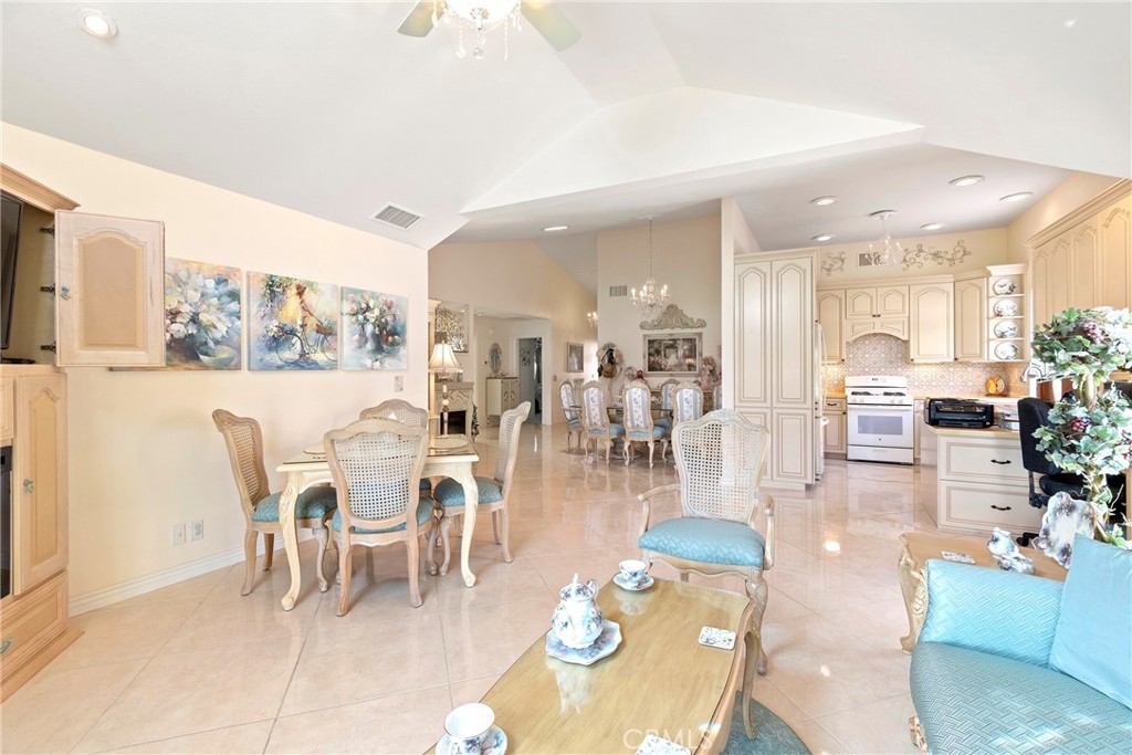 762 Torrey Pines Road Banning, CA 92220 - Photo 13 of 43 a dining room with wooden floor and large window