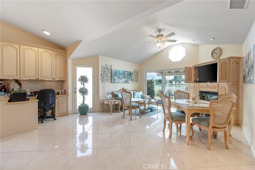 762 Torrey Pines Road Banning, CA 92220 - Photo 15 of 43 a view of a dining room with furniture a chandelier and wooden floor