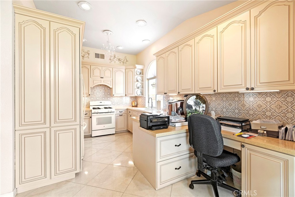 762 Torrey Pines Road Banning, CA 92220 - Photo 21 of 43 a view of a kitchen with appliances and cabinets