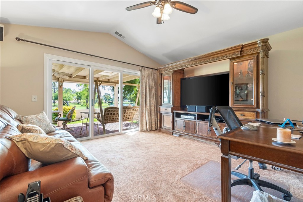 762 Torrey Pines Road Banning, CA 92220 - Photo 29 of 43 a living room with furniture and a flat screen tv