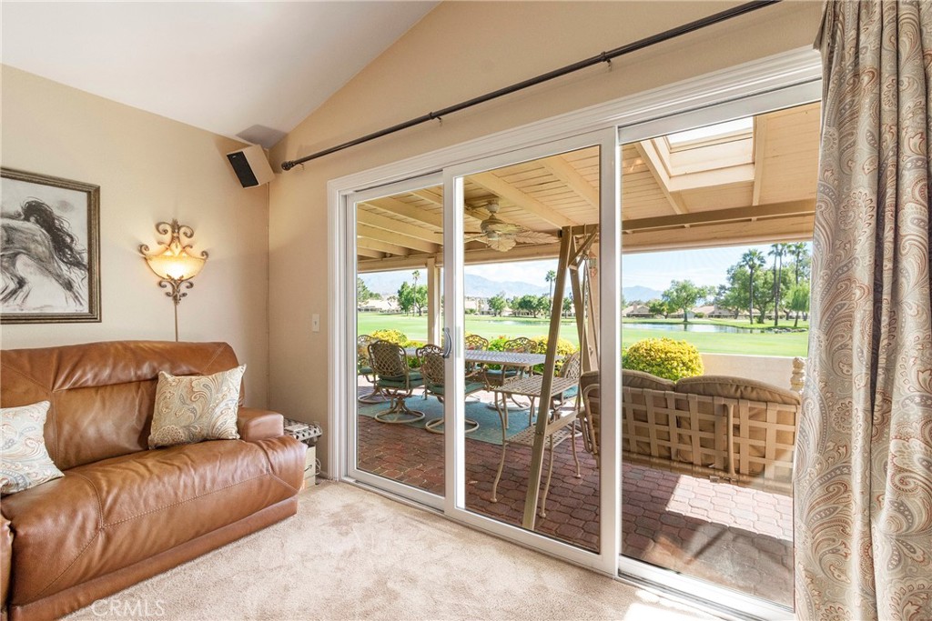 762 Torrey Pines Road Banning, CA 92220 - Photo 30 of 43 a living room with a large window and a glass door