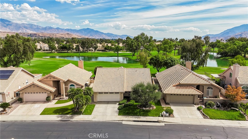 762 Torrey Pines Road Banning, CA 92220 - Photo 3 of 43 an aerial view of a house with a garden and lake view