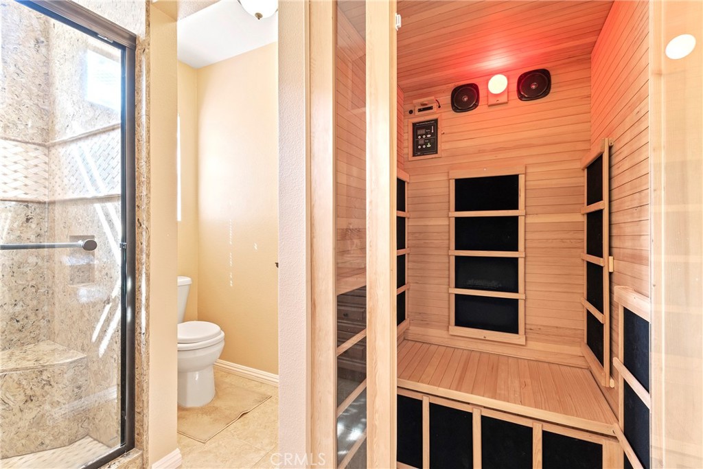 762 Torrey Pines Road Banning, CA 92220 - Photo 33 of 43 a view of a bathroom with a toilet and a shower