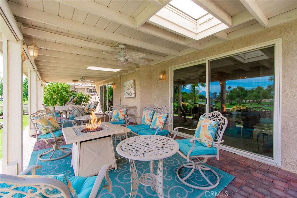 762 Torrey Pines Road Banning, CA 92220 - Photo 34 of 43 a view of a dining room with furniture wooden floor and a chandelier