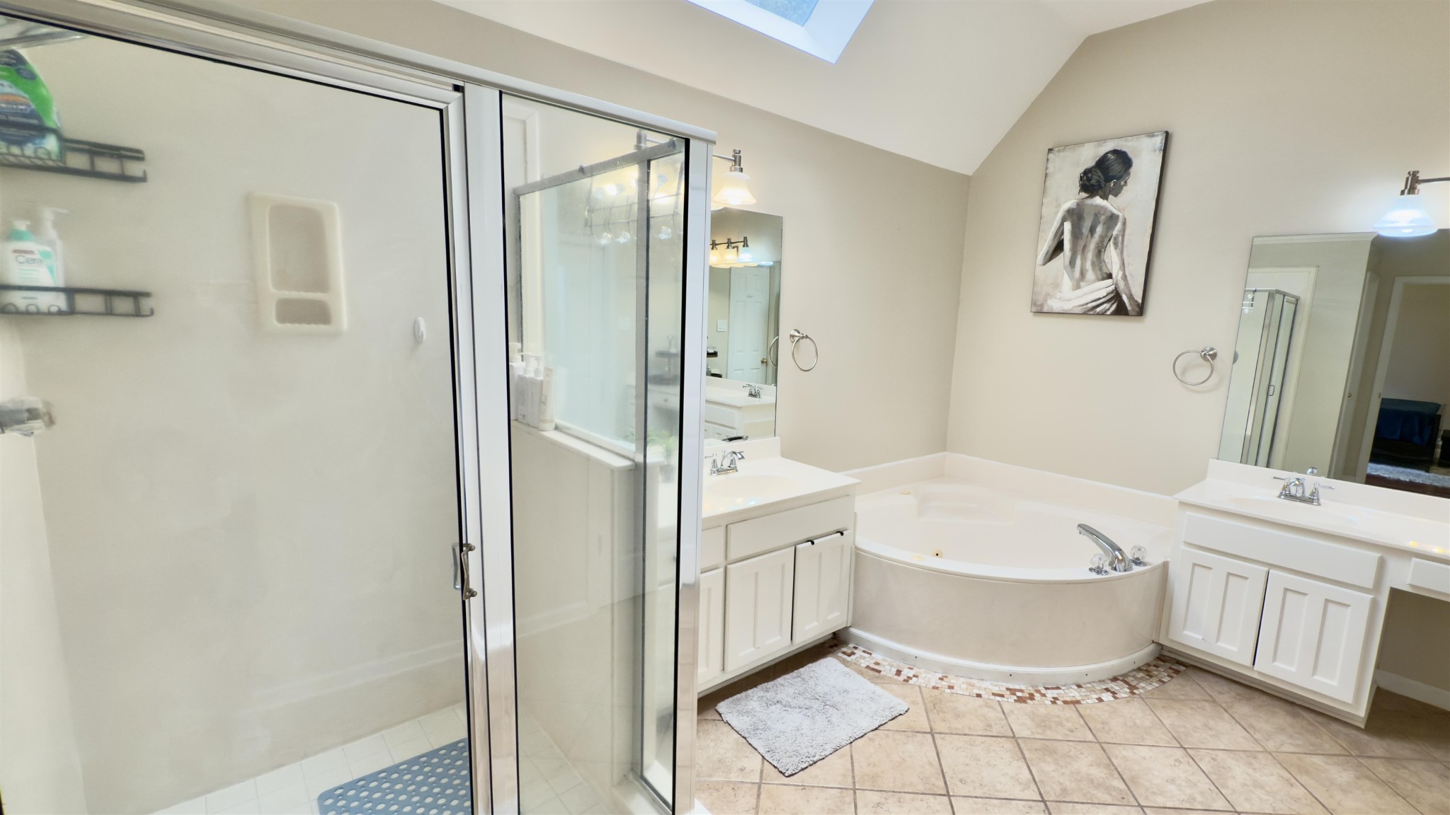 1082 Sugar Lane Collierville, TN 38017 - Photo 12 of 25 a bathroom with a white tub shower vanity and a sink