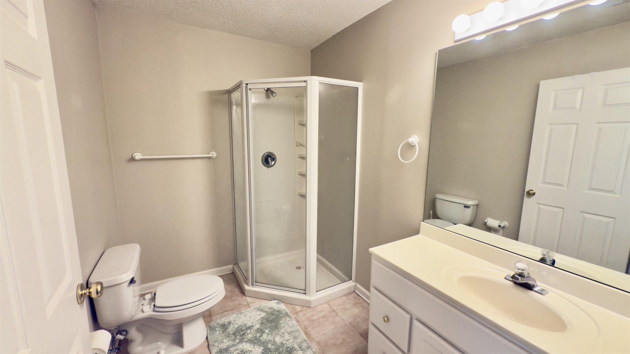 1082 Sugar Lane Collierville, TN 38017 - Photo 18 of 25 a bathroom with a sink toilet and shower