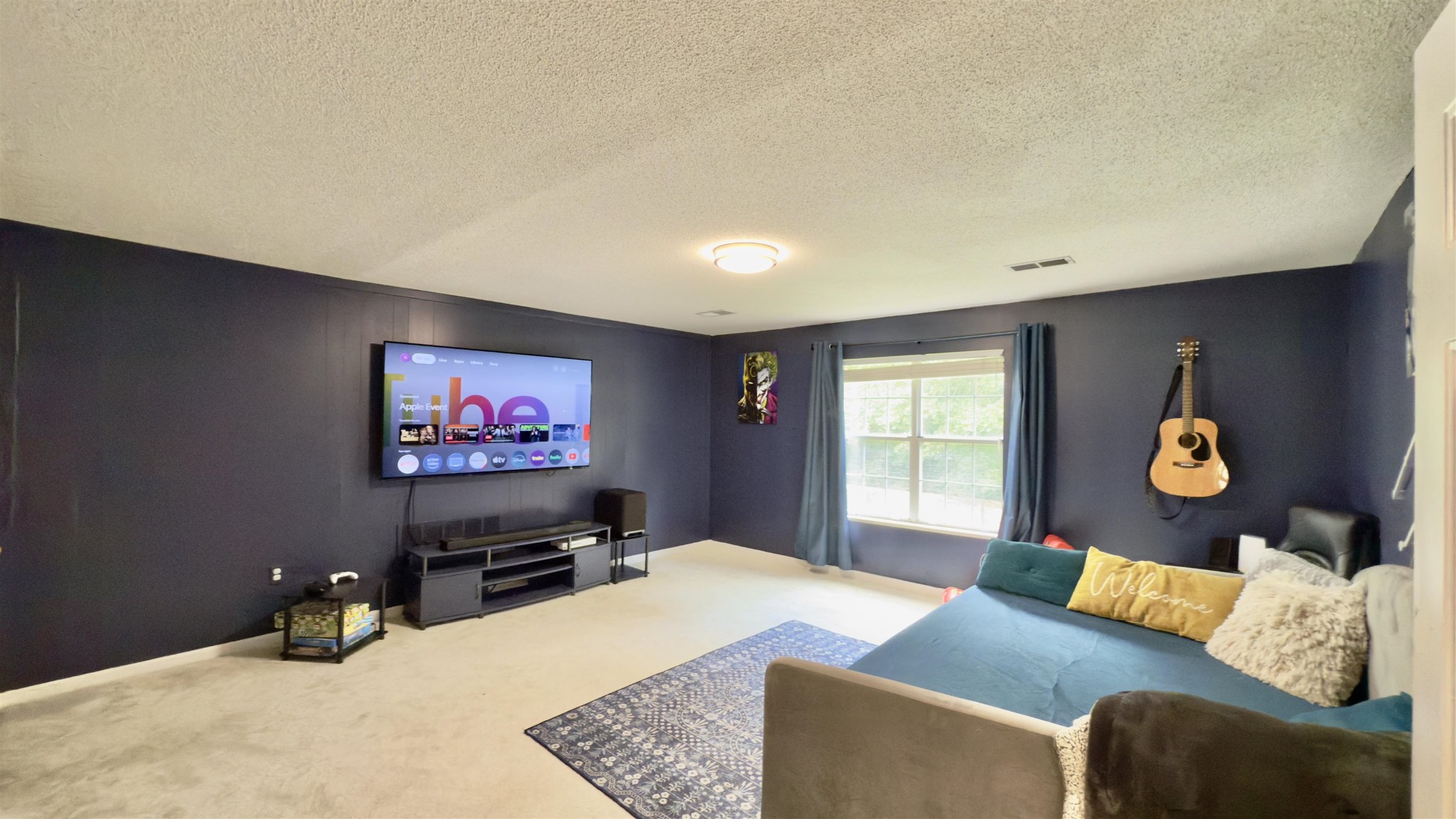 1082 Sugar Lane Collierville, TN 38017 - Photo 19 of 25 a bedroom with furniture and a flat screen tv