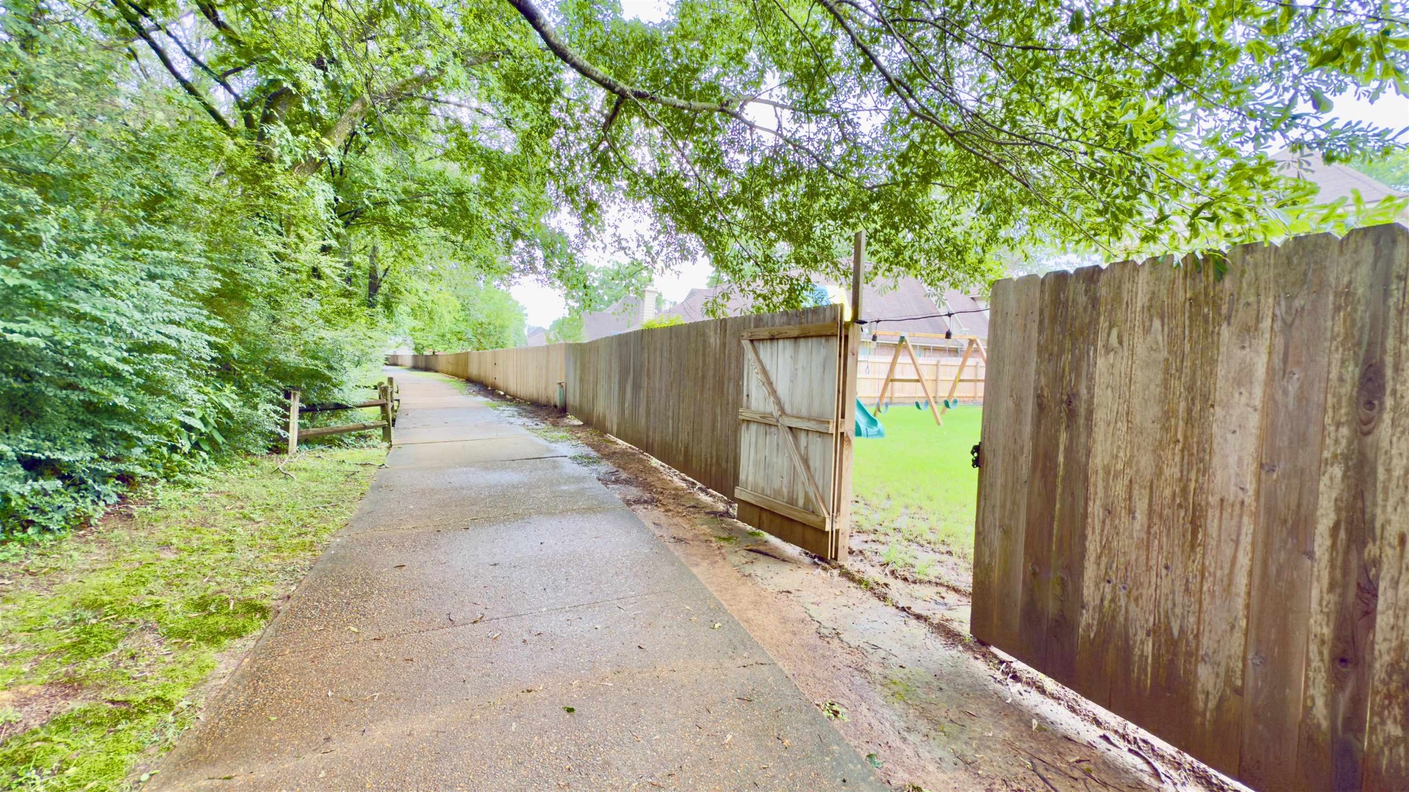 1082 Sugar Lane Collierville, TN 38017 - Photo 23 of 25 a view of a pathway of a wooden fence and trees