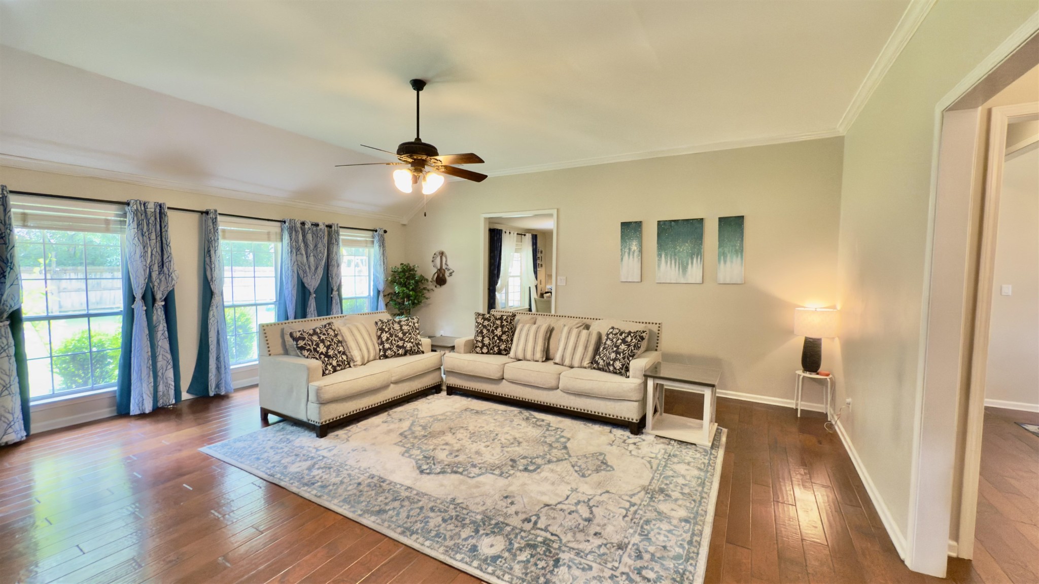 1082 Sugar Lane Collierville, TN 38017 - Photo 5 of 25 a living room with furniture and a chandelier