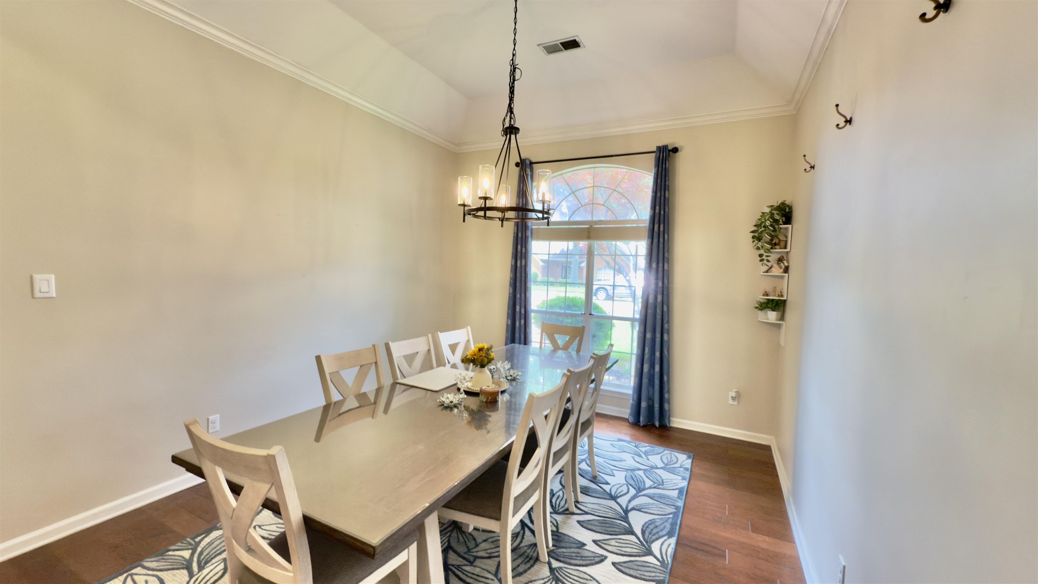 1082 Sugar Lane Collierville, TN 38017 - Photo 7 of 25 a view of a dining room with furniture and a chandelier