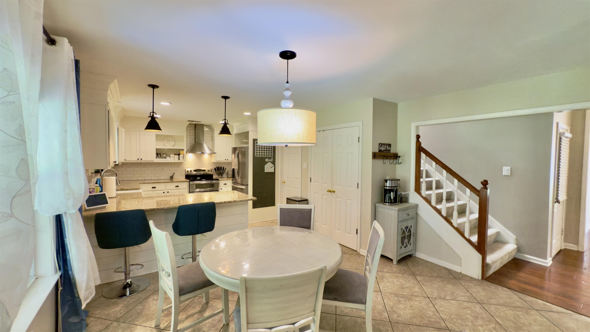 1082 Sugar Lane Collierville, TN 38017 - Photo 9 of 25 a large kitchen with a table and chairs