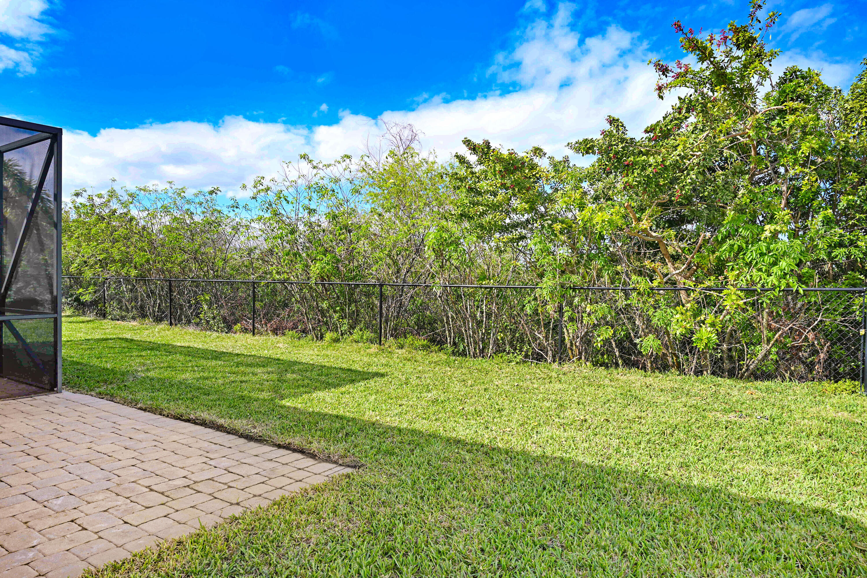 3901 Brantley Circle Rockledge, FL 32955 - Photo 15 of 33 a view of a field with a tree in the background