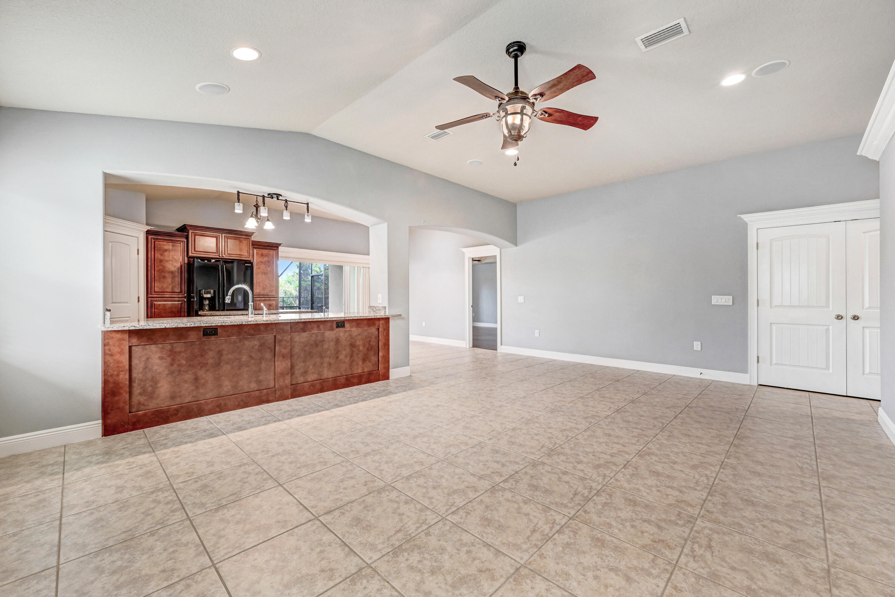 3901 Brantley Circle Rockledge, FL 32955 - Photo 16 of 33 a view of a kitchen with a sink and a living room