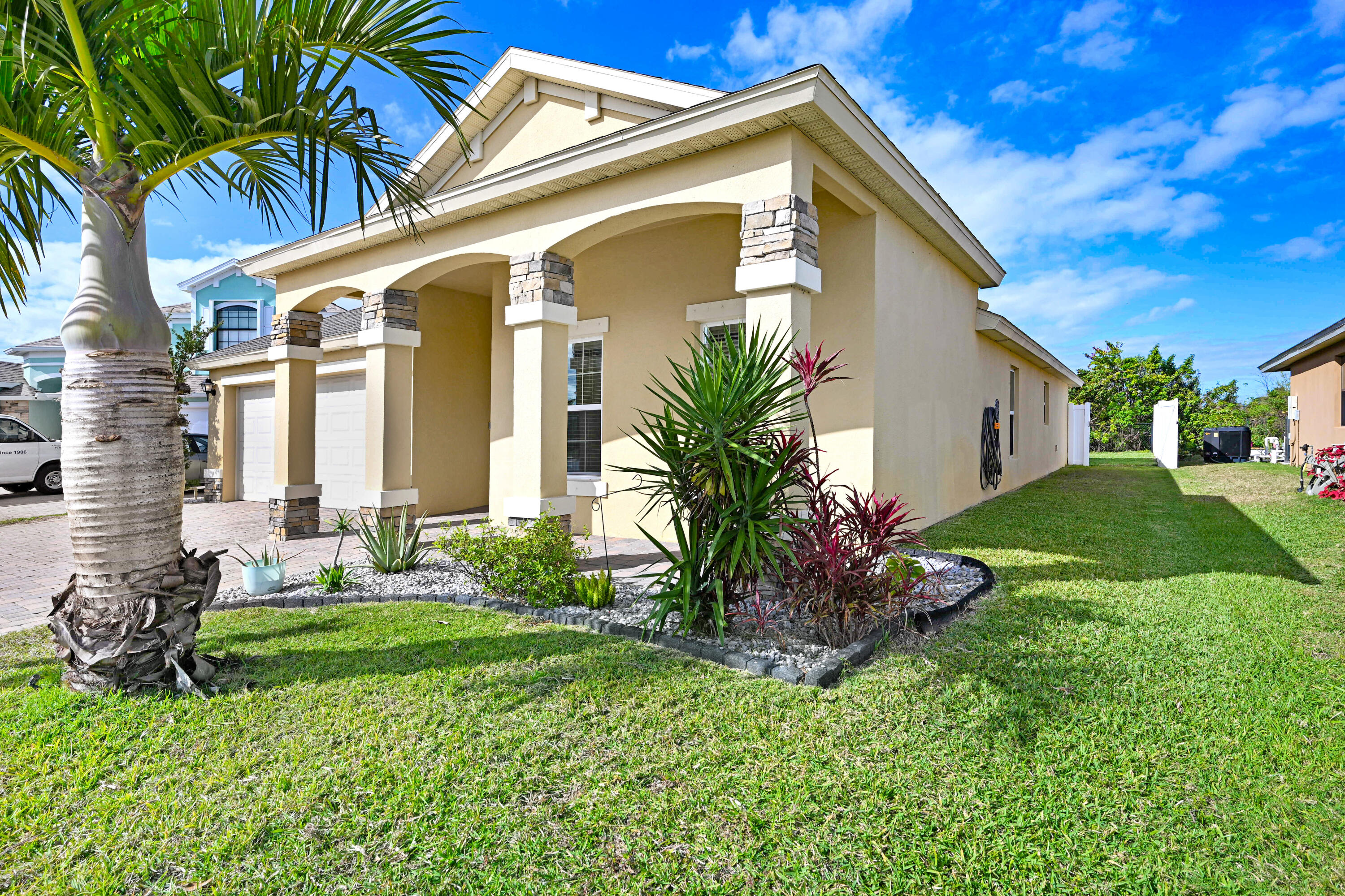 3901 Brantley Circle Rockledge, FL 32955 - Photo 9 of 33 a view of a house with a small yard plants and a small yard