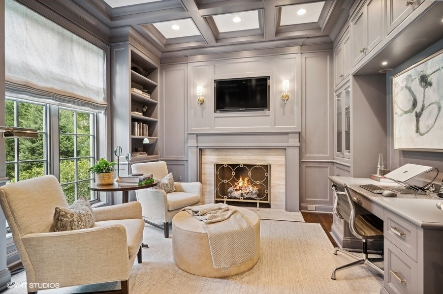 844 Prospect Avenue Winnetka, IL 60093 - Photo 12 of 27 a living room with furniture a flat screen tv and a fireplace