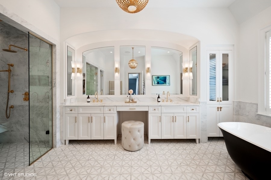 844 Prospect Avenue Winnetka, IL 60093 - Photo 17 of 27 a spacious bathroom with a double vanity sink mirror and bathtub