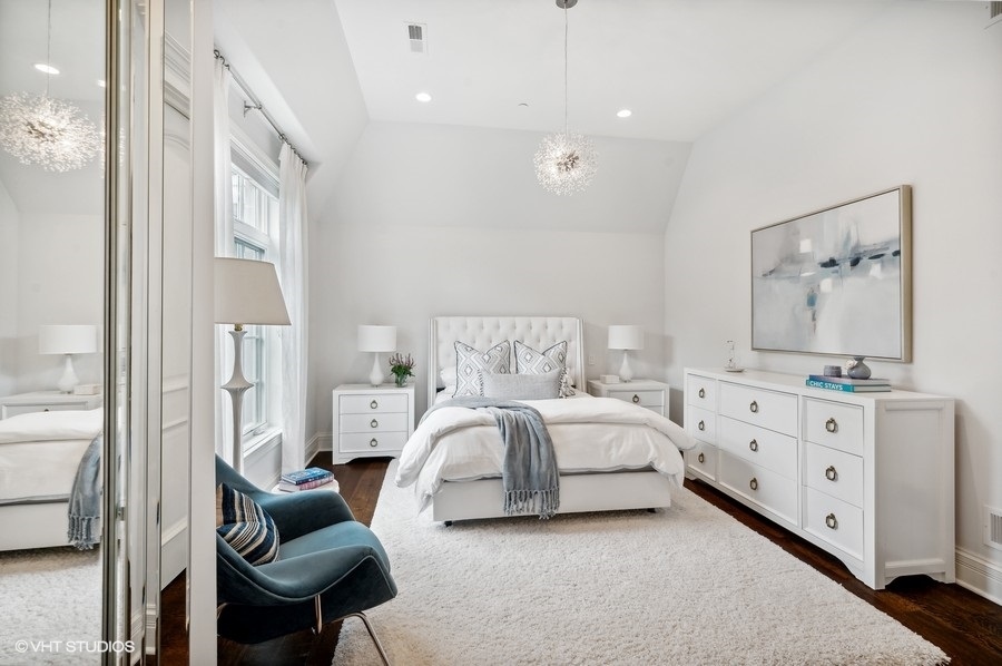 844 Prospect Avenue Winnetka, IL 60093 - Photo 18 of 27 a spacious bedroom with a large bed and a dresser