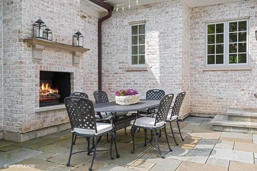 844 Prospect Avenue Winnetka, IL 60093 - Photo 27 of 27 a view of a patio with table and chairs and potted plants