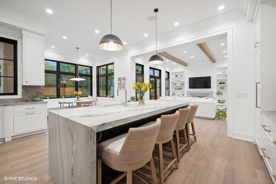 844 Prospect Avenue Winnetka, IL 60093 - Photo 8 of 27 an open kitchen with a table and chairs in it