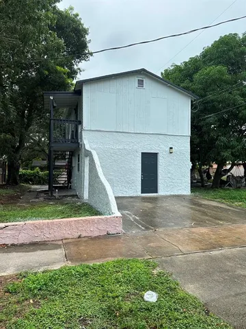 a backyard of a house with lots of green space