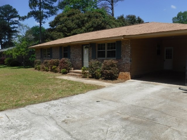 1511 Kingston Road Perry, GA 31069 - Photo 1 of 13 a front view of house with yard and green space