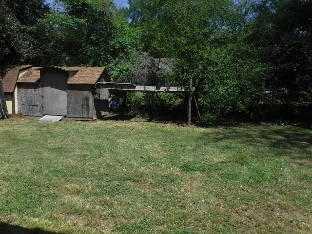 1511 Kingston Road Perry, GA 31069 - Photo 13 of 13 a view of a house with a backyard