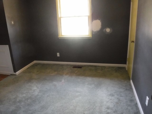 1511 Kingston Road Perry, GA 31069 - Photo 10 of 13 an empty room with a window