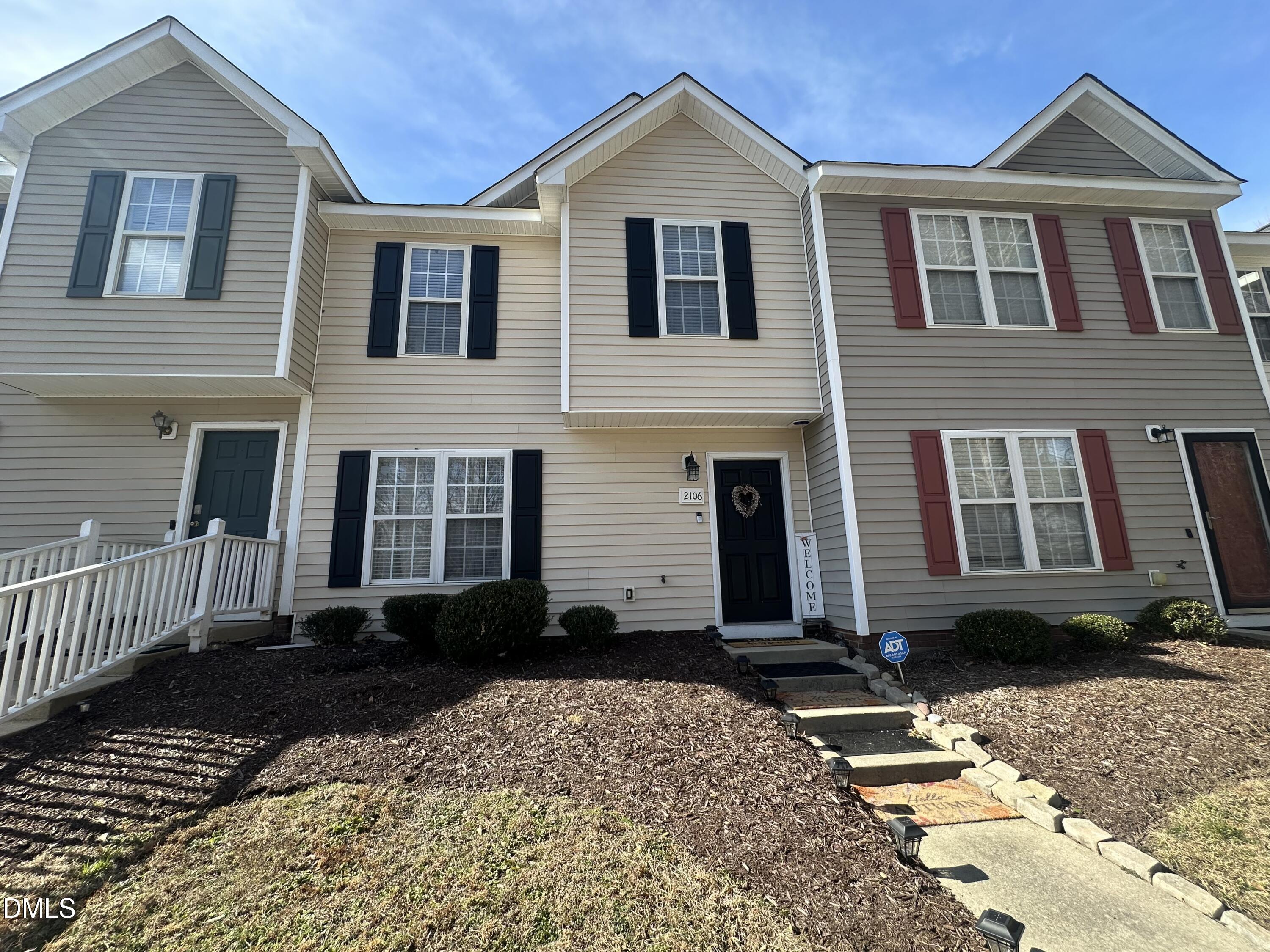 2106 Walnut Bluffs Lane Raleigh, NC 27610 - Photo 1 of 15 a front view of a house with a yard